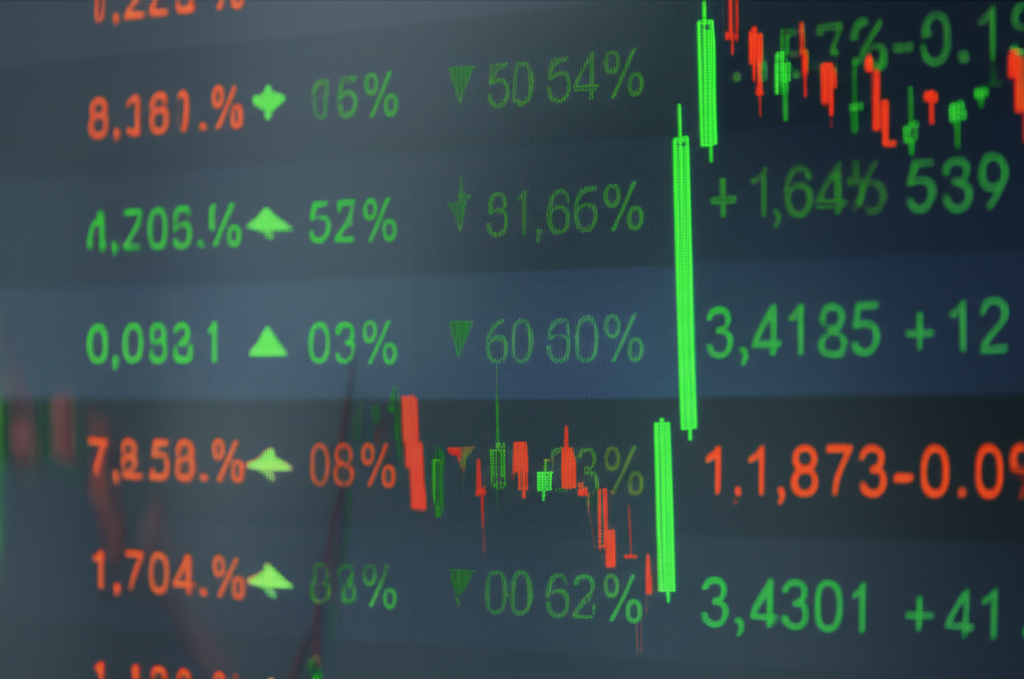 Cryptocurrency trading on a digital platform with multiple screens showing live price action